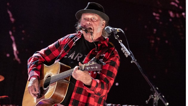 Neil Young performs at benefit show in first live appearance of the year