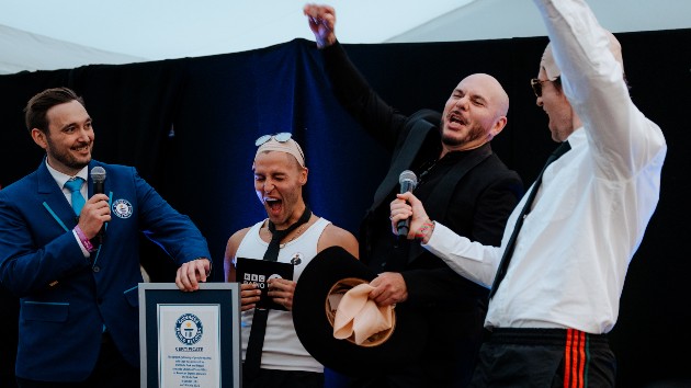 Pitbull sets record for largest gathering of people wearing bald caps
